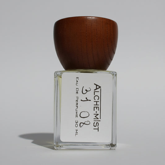 Perfume bottle with wooden cap on a white background